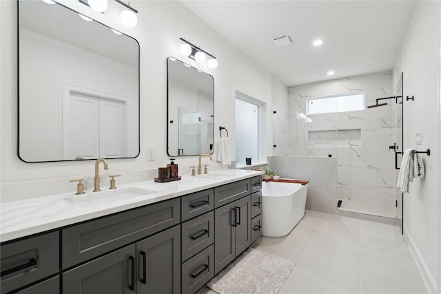 3731 Lydia St, Houston, TX 77021 - bathroom with a marble finish shower, double vanity, a freestanding tub, tile patterned flooring, and recessed lighting