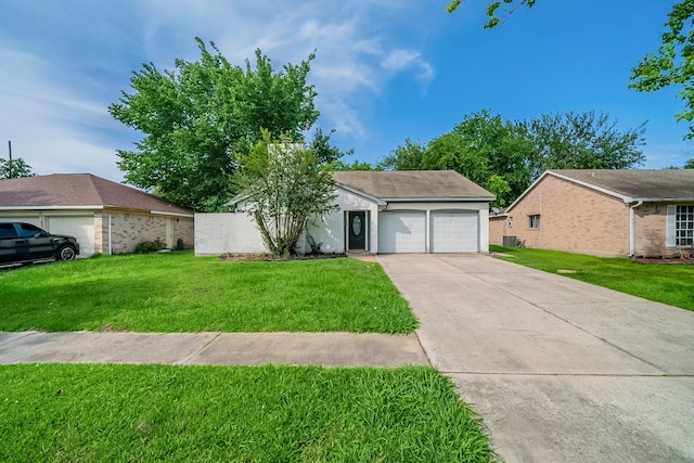 7218 Winding Trace Dr, Houston, TX 77086 - view of front of home with a garage, concrete driveway, and a front yard