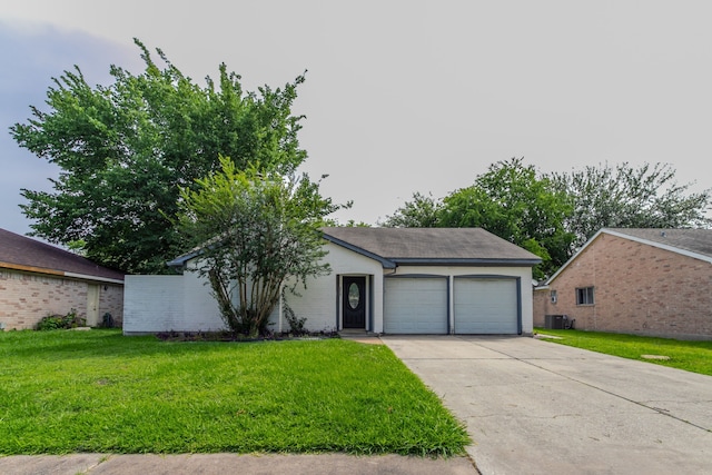 7218 Winding Trace Dr, Houston, TX 77086 - view of front of property with an attached garage, a front yard, central air condition unit, and driveway