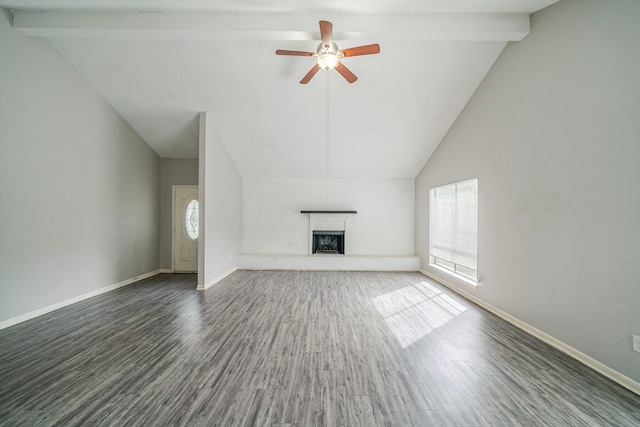 7218 Winding Trace Dr, Houston, TX 77086 - unfurnished living room featuring plenty of natural light, wood finished floors, a ceiling fan, and a fireplace with raised hearth