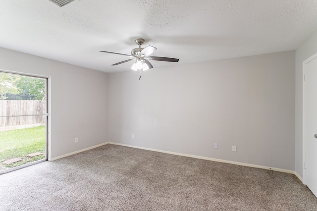 7218 Winding Trace Dr, Houston, TX 77086 - carpeted spare room with ceiling fan, a textured ceiling, and baseboards