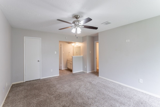7218 Winding Trace Dr, Houston, TX 77086 - unfurnished bedroom featuring light colored carpet, baseboards, ceiling fan, and connected bathroom