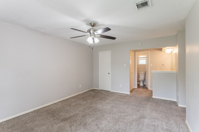 7218 Winding Trace Dr, Houston, TX 77086 - spare room featuring carpet flooring, ceiling fan, and baseboards
