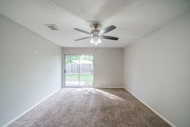 7218 Winding Trace Dr, Houston, TX 77086 - unfurnished room with ceiling fan, carpet flooring, a textured ceiling, and baseboards