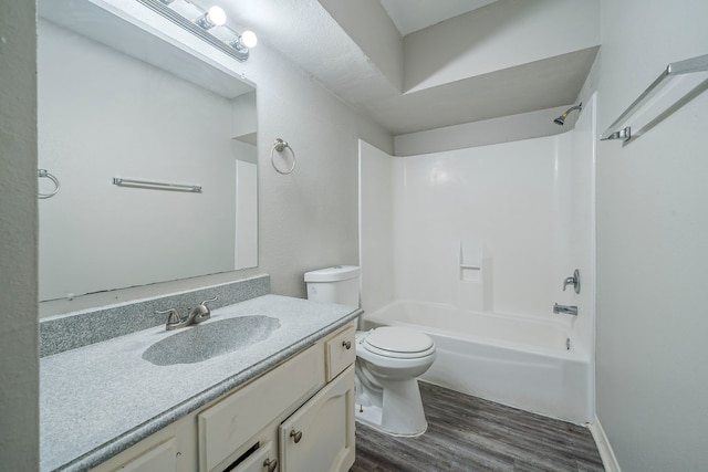 7218 Winding Trace Dr, Houston, TX 77086 - full bathroom with wood finished floors, bathtub / shower combination, toilet, and vanity