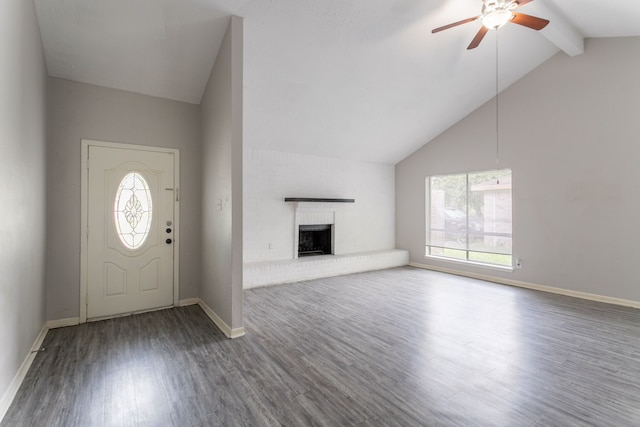 7218 Winding Trace Dr, Houston, TX 77086 - entryway featuring wood finished floors, healthy amount of natural light, a ceiling fan, a brick fireplace, and beamed ceiling