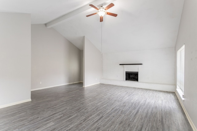 7218 Winding Trace Dr, Houston, TX 77086 - unfurnished living room featuring a ceiling fan, wood finished floors, a brick fireplace, beamed ceiling, and baseboards