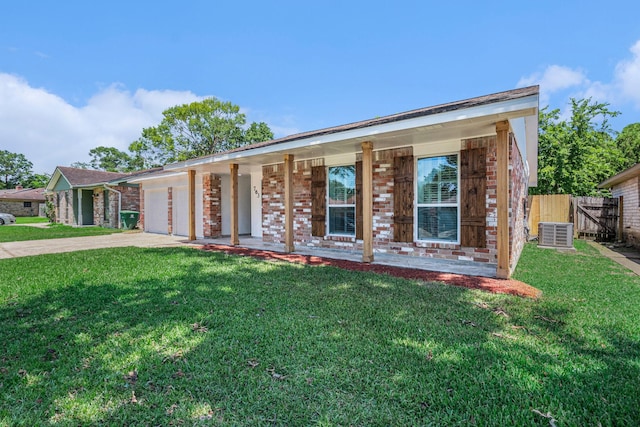 763 Voyager Dr, Houston, TX 77062 - view of front facade featuring concrete driveway, brick siding, an attached garage, and a porch