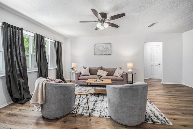 763 Voyager Dr, Houston, TX 77062 - living room with wood finished floors, ceiling fan, a textured ceiling, and baseboards