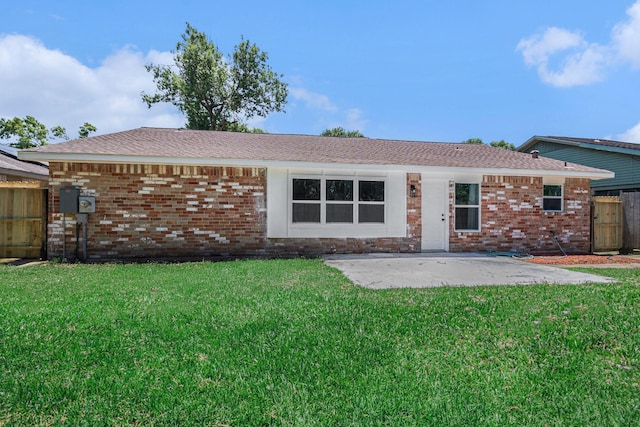 763 Voyager Dr, Houston, TX 77062 - back of house with a patio, brick siding, and roof with shingles