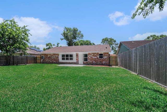 763 Voyager Dr, Houston, TX 77062 - rear view of property with brick siding and a patio area