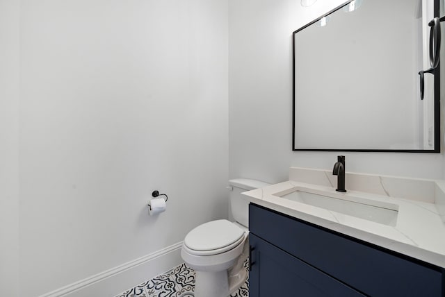 1435 Laird St, Houston, TX 77008 - bathroom featuring toilet, baseboards, vanity, and tile patterned floors