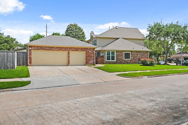 8303 Big Bend Dr, Sugar Land, TX 77479 - view of front of house featuring driveway, brick siding, an attached garage, and a shingled roof
