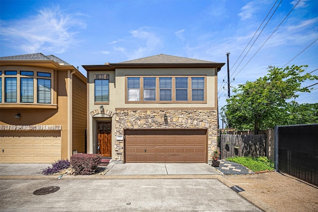 1380 Studer St, Houston, TX 77007 - view of front of house with concrete driveway, stucco siding, an attached garage, and stone siding