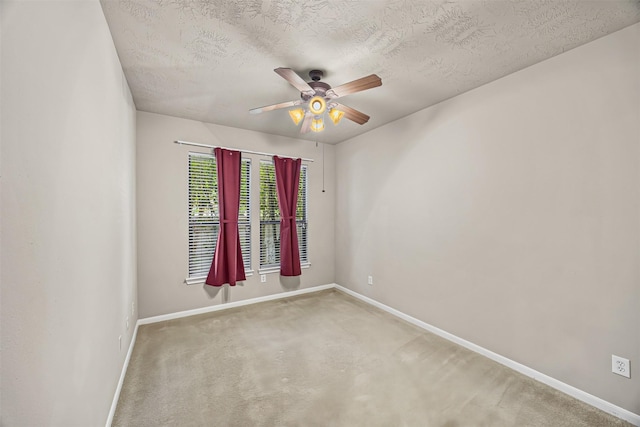 1380 Studer St, Houston, TX 77007 - empty room with baseboards, ceiling fan, carpet flooring, and a textured ceiling