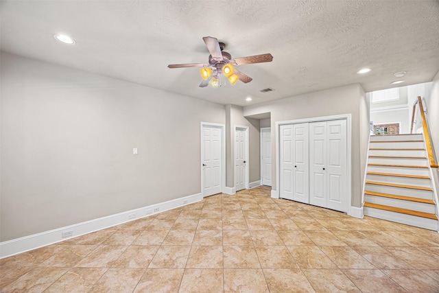 1380 Studer St, Houston, TX 77007 - unfurnished bedroom featuring recessed lighting, two closets, baseboards, a ceiling fan, and light tile patterned floors