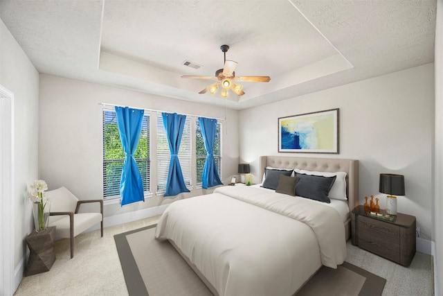 1380 Studer St, Houston, TX 77007 - bedroom with a raised ceiling, carpet flooring, baseboards, a textured ceiling, and ceiling fan