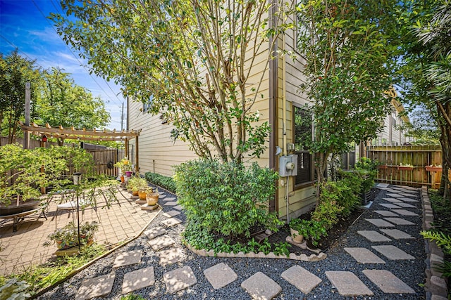 1380 Studer St, Houston, TX 77007 - view of side of property with a patio, fence, and a pergola