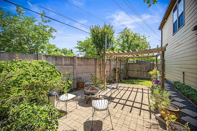 1380 Studer St, Houston, TX 77007 - view of patio / terrace with an outdoor fire pit, a fenced backyard, and a pergola