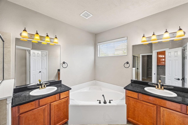1380 Studer St, Houston, TX 77007 - bathroom featuring a stall shower, a garden tub, and two vanities