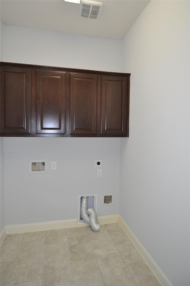 15818 Tremout Hollow Ln, Houston, TX 77044 - laundry area with hookup for an electric dryer, hookup for a washing machine, cabinet space, and baseboards