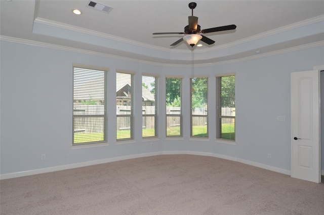 15818 Tremout Hollow Ln, Houston, TX 77044 - carpeted spare room with a ceiling fan, crown molding, a raised ceiling, and baseboards