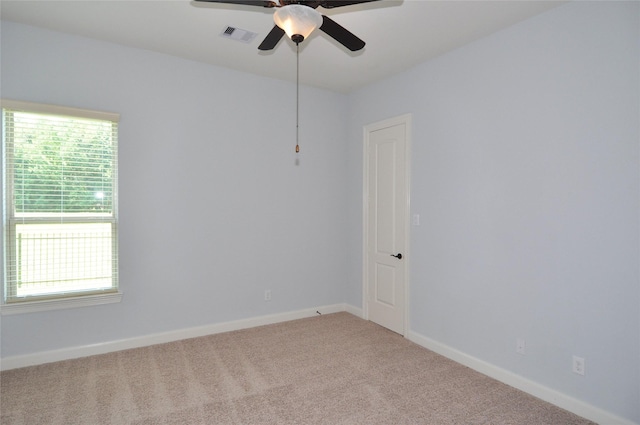 15818 Tremout Hollow Ln, Houston, TX 77044 - unfurnished room featuring plenty of natural light, ceiling fan, carpet, and baseboards