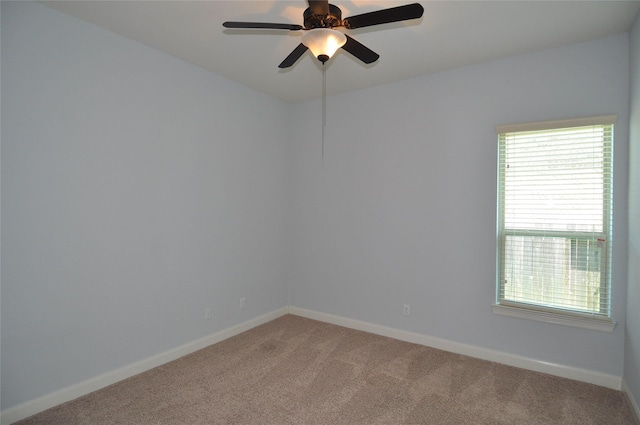 15818 Tremout Hollow Ln, Houston, TX 77044 - empty room featuring light carpet, baseboards, and a ceiling fan