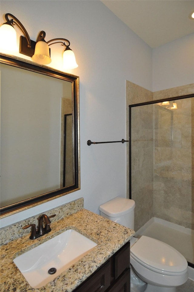 15818 Tremout Hollow Ln, Houston, TX 77044 - bathroom featuring toilet, vanity, and a tile shower