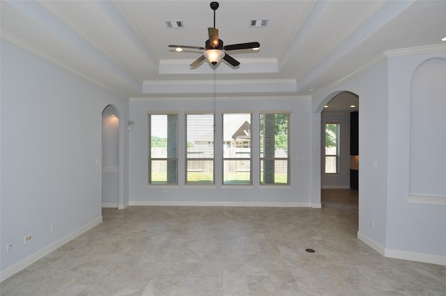 15818 Tremout Hollow Ln, Houston, TX 77044 - empty room featuring arched walkways, a tray ceiling, ceiling fan, ornamental molding, and baseboards