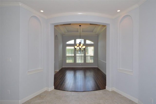 15818 Tremout Hollow Ln, Houston, TX 77044 - unfurnished dining area featuring a chandelier, arched walkways, crown molding, a raised ceiling, and baseboards