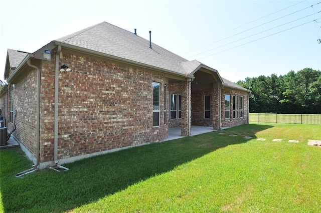 15818 Tremout Hollow Ln, Houston, TX 77044 - back of property with brick siding and a patio area