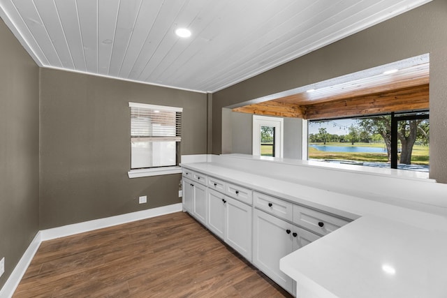 16610 Meadow Ln Unit Cr438, Danbury, TX 77534 - kitchen with healthy amount of natural light, white cabinets, dark wood-style flooring, wooden ceiling, and recessed lighting