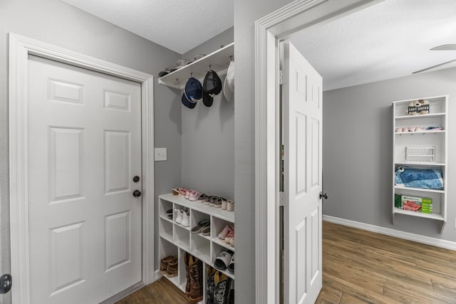 16610 Meadow Ln Unit Cr438, Danbury, TX 77534 - mudroom with a textured ceiling, wood finished floors, and baseboards