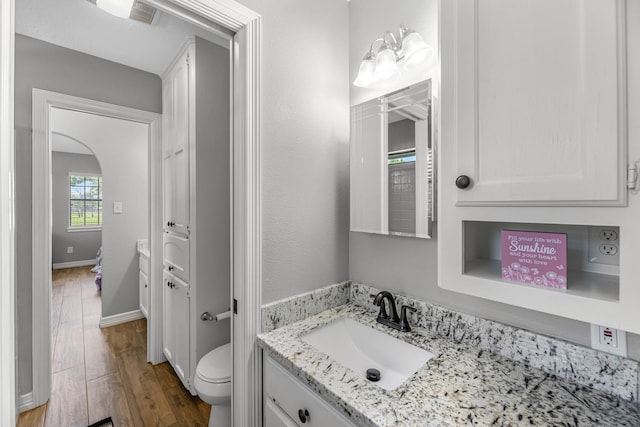 16610 Meadow Ln Unit Cr438, Danbury, TX 77534 - bathroom with wood finished floors, vanity, toilet, and baseboards