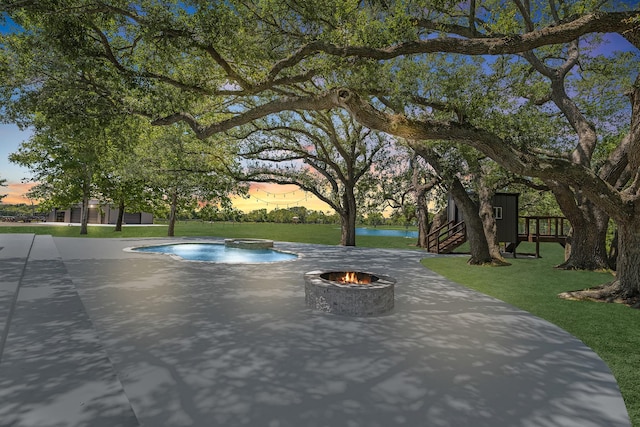 16610 Meadow Ln Unit Cr438, Danbury, TX 77534 - surrounding community featuring a fire pit, a patio, and a lawn