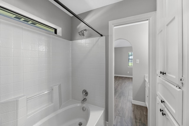 16610 Meadow Ln Unit Cr438, Danbury, TX 77534 - bathroom featuring shower / washtub combination, baseboards, and wood finished floors