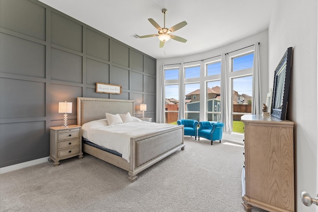 2006 Green Haven Ct, Missouri City, TX 77459 - bedroom with a decorative wall, light carpet, and a ceiling fan