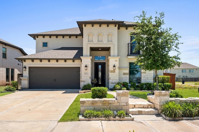 2006 Green Haven Ct, Missouri City, TX 77459 - mediterranean / spanish-style home featuring a garage, concrete driveway, stucco siding, stone siding, and a shingled roof