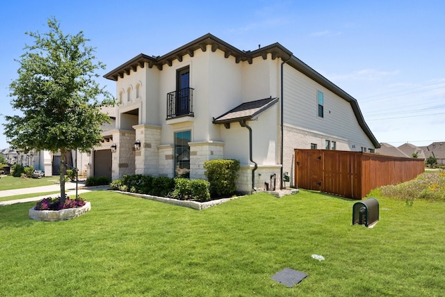 2006 Green Haven Ct, Missouri City, TX 77459 - view of home's exterior featuring a balcony, stucco siding, an attached garage, and stone siding
