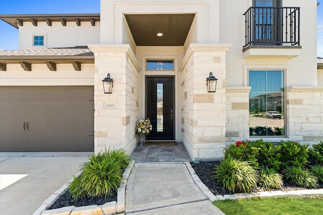2006 Green Haven Ct, Missouri City, TX 77459 - property entrance with stone siding, a balcony, driveway, and a garage