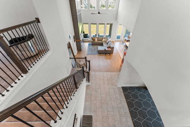 2006 Green Haven Ct, Missouri City, TX 77459 - stairway with a high ceiling, wood finished floors, and a ceiling fan