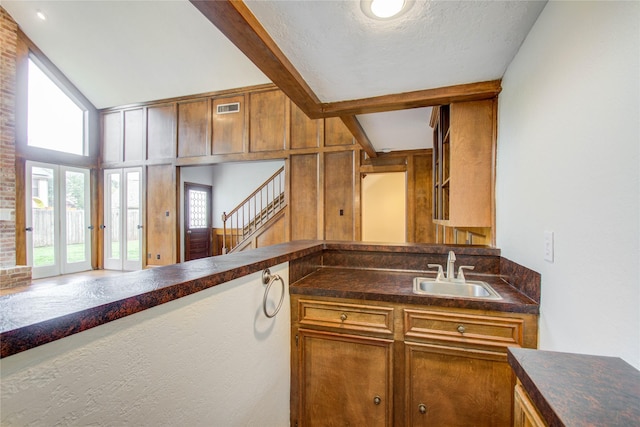 506 Windsor Glen Dr, Katy, TX 77450 - kitchen with a sink, dark countertops, and brown cabinets