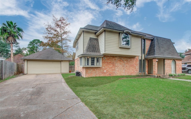 506 Windsor Glen Dr, Katy, TX 77450 - view of front of property with brick siding, a detached garage, an outbuilding, and a shingled roof