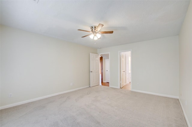 506 Windsor Glen Dr, Katy, TX 77450 - spare room featuring ceiling fan, light colored carpet, and baseboards