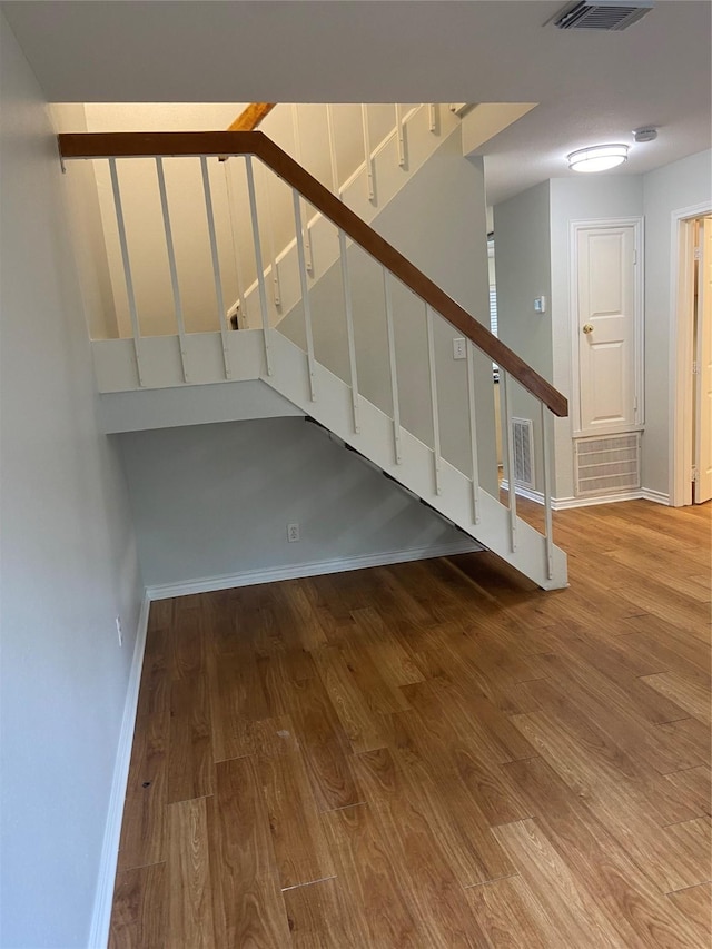 2403 W Settlers Way, Spring, TX 77380 - staircase featuring wood finished floors and baseboards