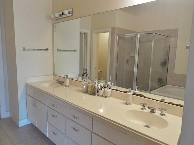3501 Link Valley Dr Unit 1004, Houston, TX 77025 - full bathroom with a stall shower, tile patterned flooring, double vanity, and baseboards