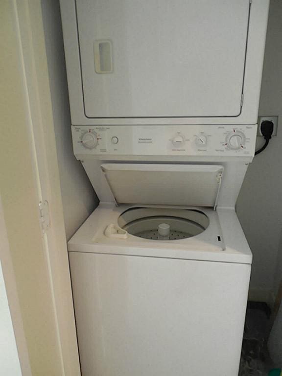 3501 Link Valley Dr Unit 1004, Houston, TX 77025 - laundry area with stacked washer / dryer