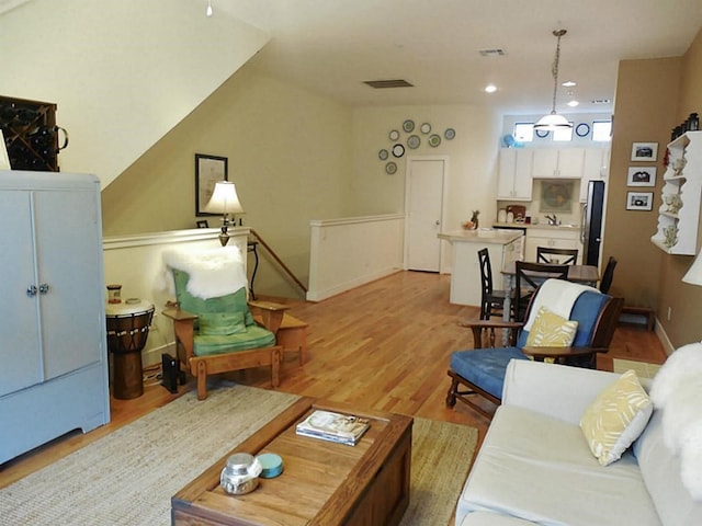 3501 Link Valley Dr Unit 1004, Houston, TX 77025 - living area with light wood-style floors and recessed lighting
