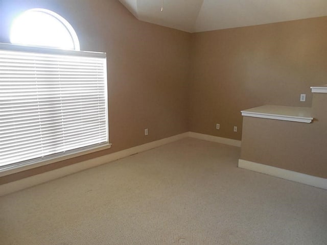 3501 Link Valley Dr Unit 1004, Houston, TX 77025 - spare room with vaulted ceiling, light colored carpet, and baseboards